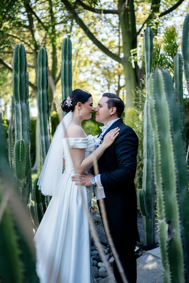 Couple kissing among cacti at Lago Escondido, Jalisco