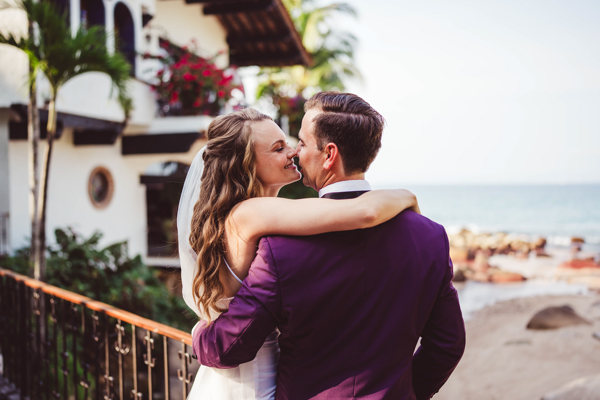 Bride and groom embracing on an oceanfront terrace, Puerto Vallarta